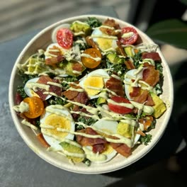 Cobb Goddess salad with egg, bacon, avocado and cherry tomatoes